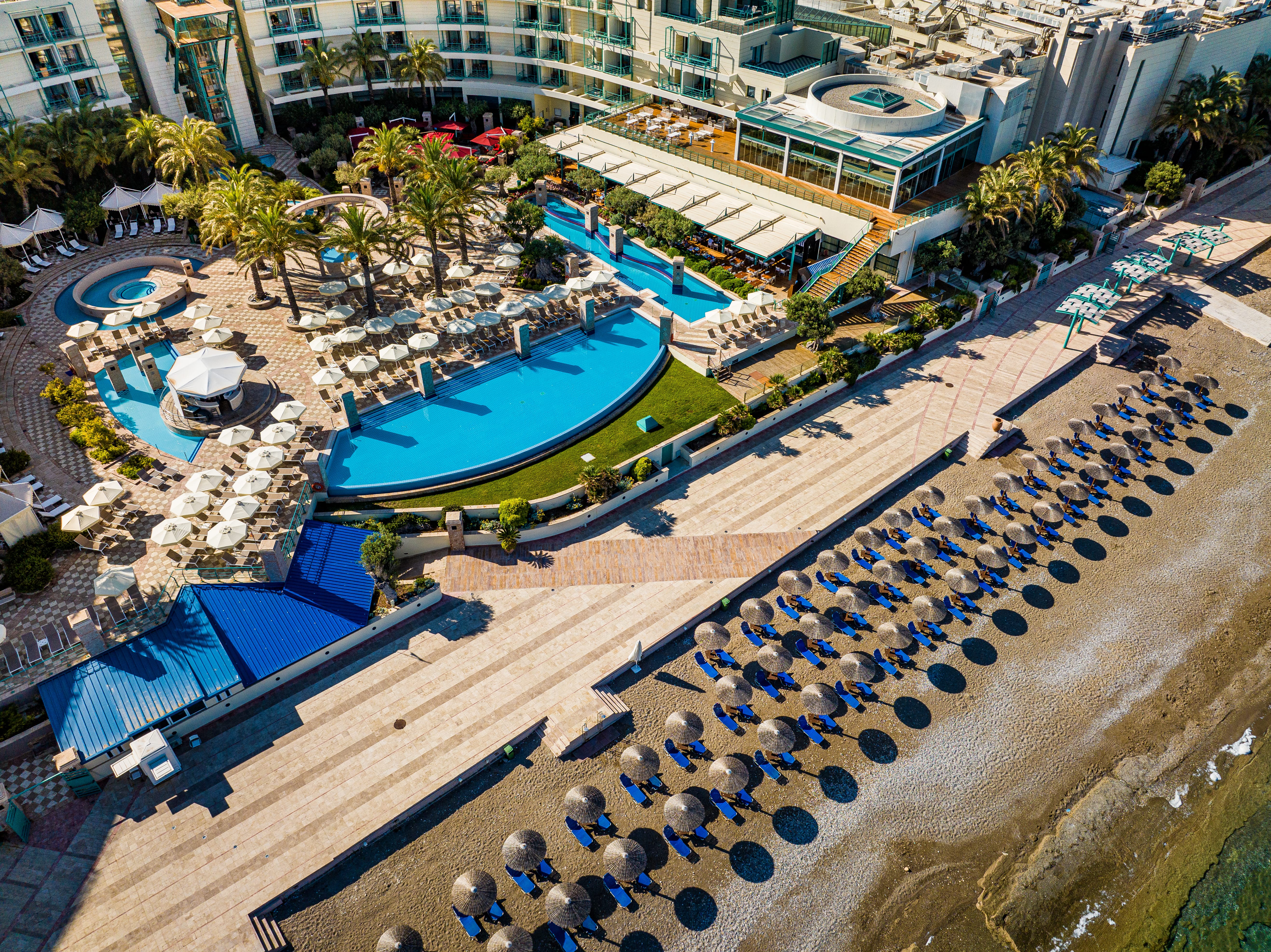 a swimming pool with a building in the background